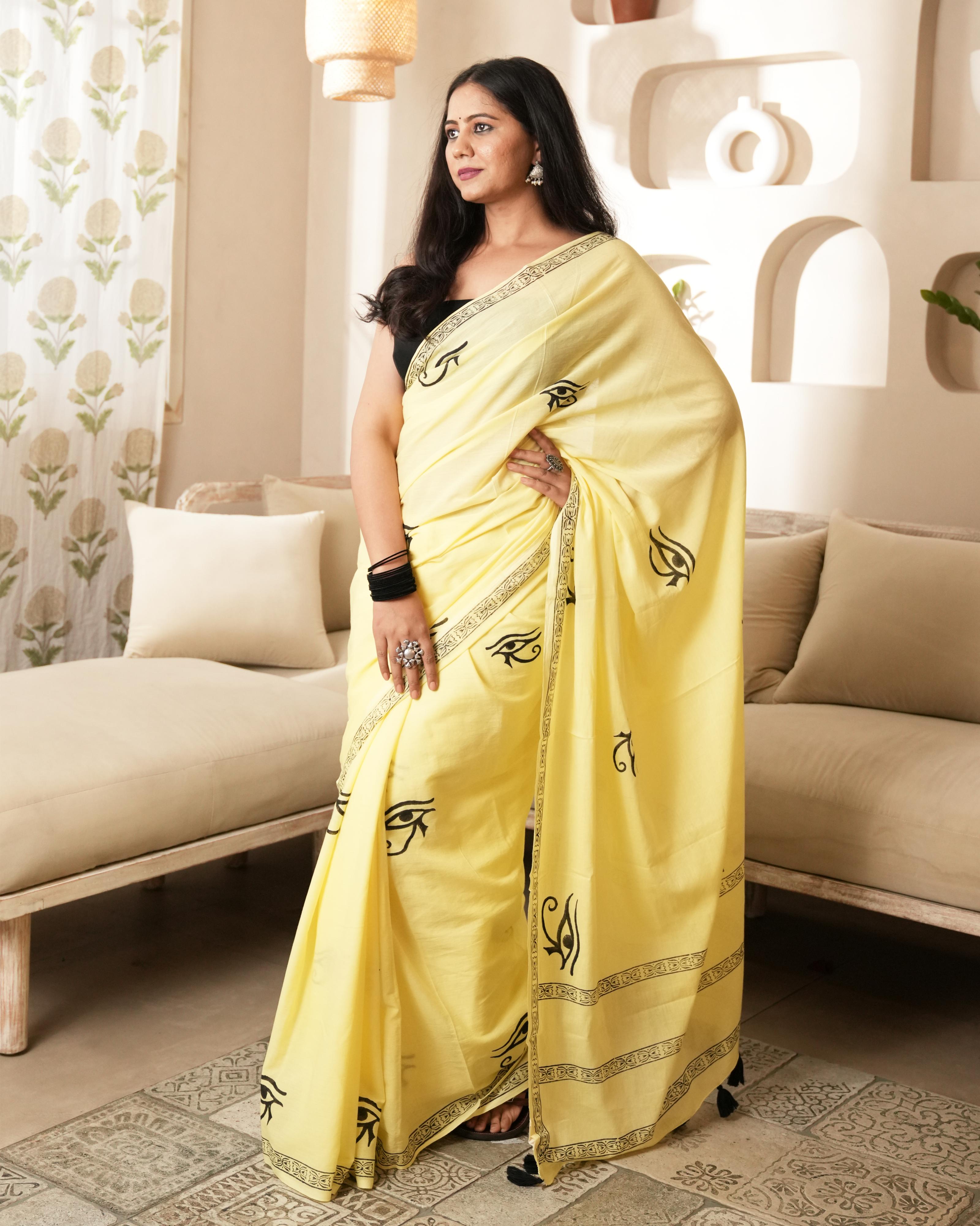 Handblock Print Mul Cotton Saree | Yellow Spiritual Eye Black Tassel for Festive & Cultural Wear