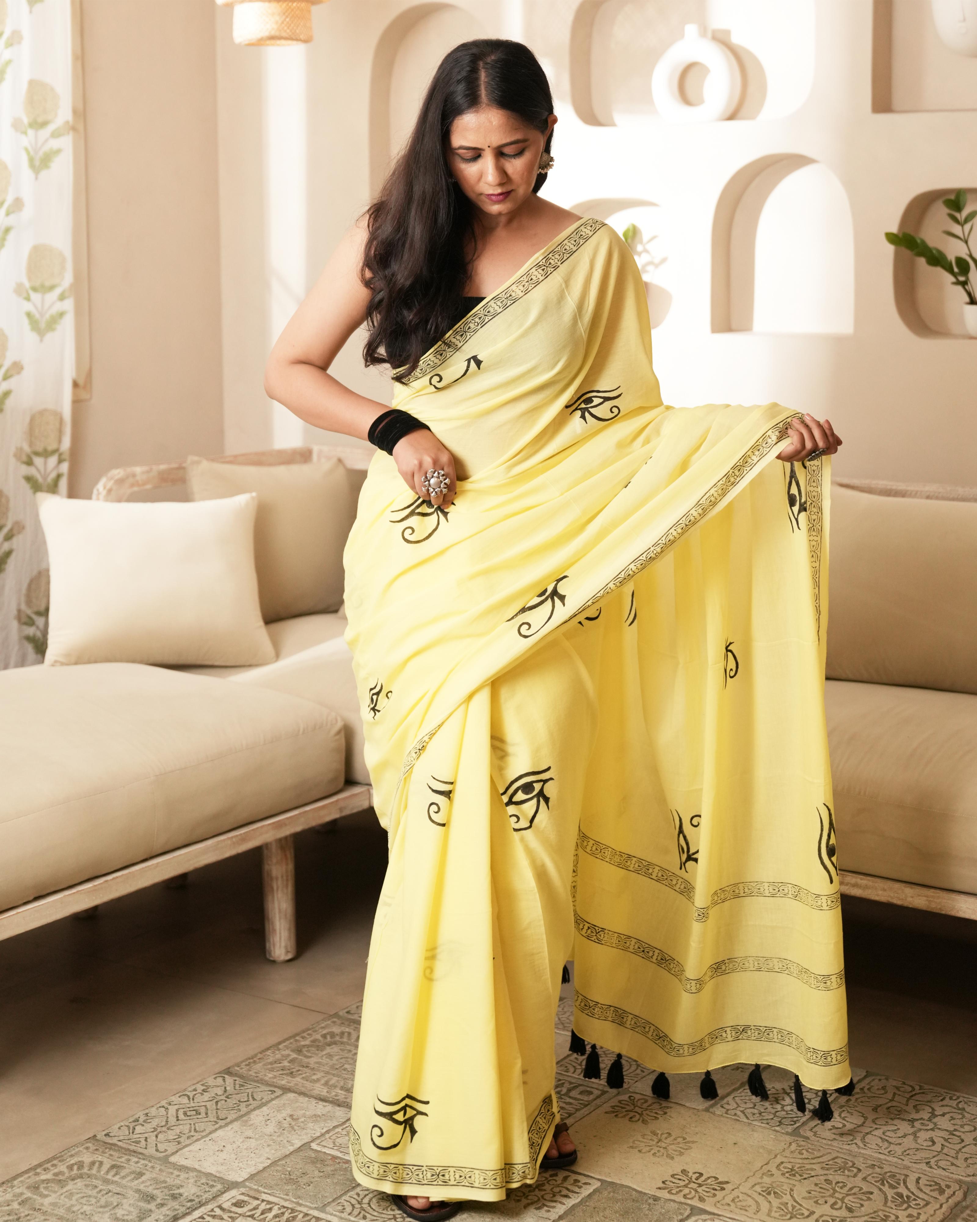 Handblock Print Mul Cotton Saree | Yellow Spiritual Eye Black Tassel for Festive & Cultural Wear